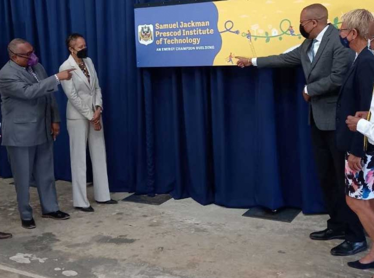 From left: IDB representative Juan Carlos De La Hoz Viñas; SJPI Principal, Ian Drakes; Education Minister, Santia Bradshaw, Energy Minister, Kerrie Symmonds; New Head of Delegation to the EU, Ambassador Malgorzata Wasilewska, and Permanent Secretary, Special Projects in the Ministry of Energy, Andrew Gittens, admiring the Energy Champion Brand after its unveiling today. (J. Carrington/BGIS)