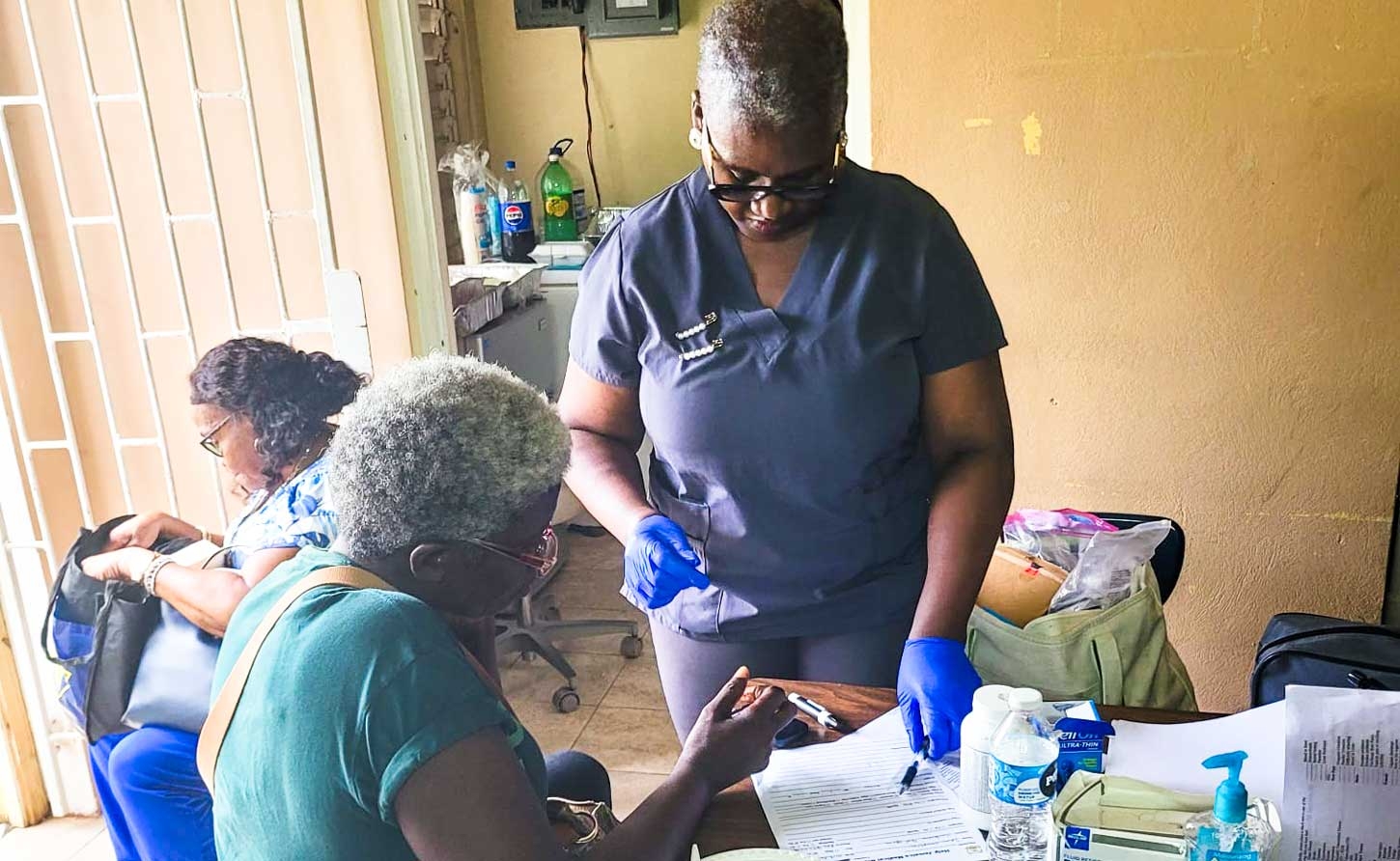 Patient being attended to at the Seaford Town Sacred Heart Health Centre, site of the  Help Jamaica Health Fair.