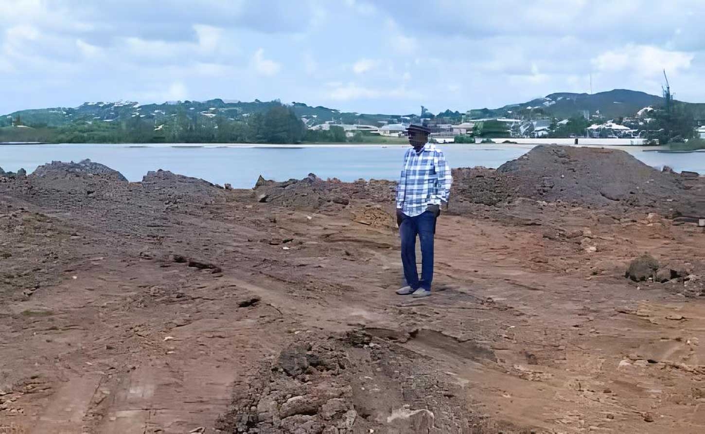 Alister Thomas, United Progressive Party (UPP) Caretaker  in the constituency of St. Johns City West perusing the dump site for the  excavations from the Bethel cemetry.