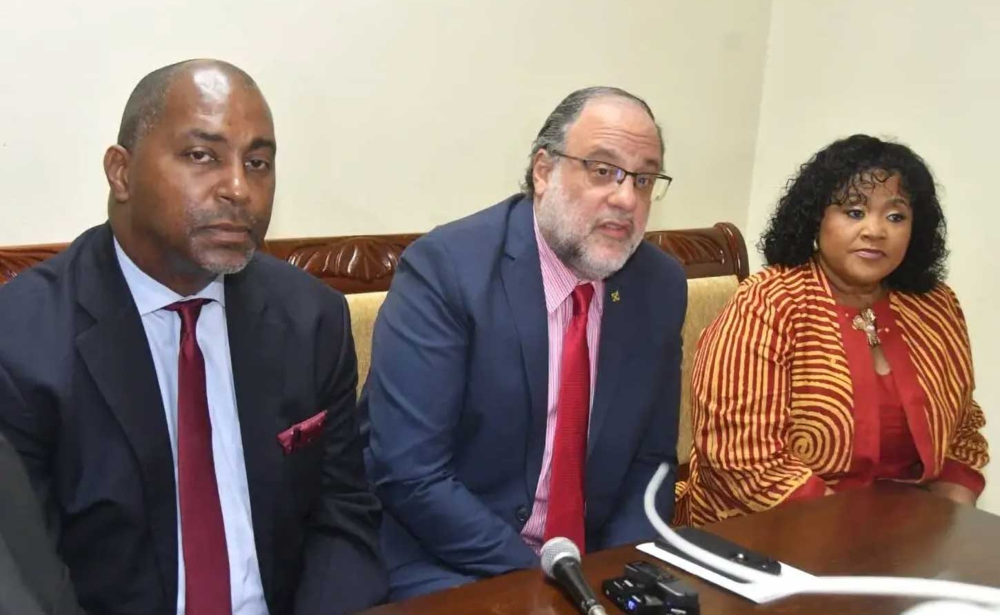 Opposition Leader Mark Golding (centre) at a press conference following the ceremonial opening of Parliament on Thursday. He is flanked by  spokesman on finance, Julian Robinson, and  spokesperson on local government Natalie Neita Garvey