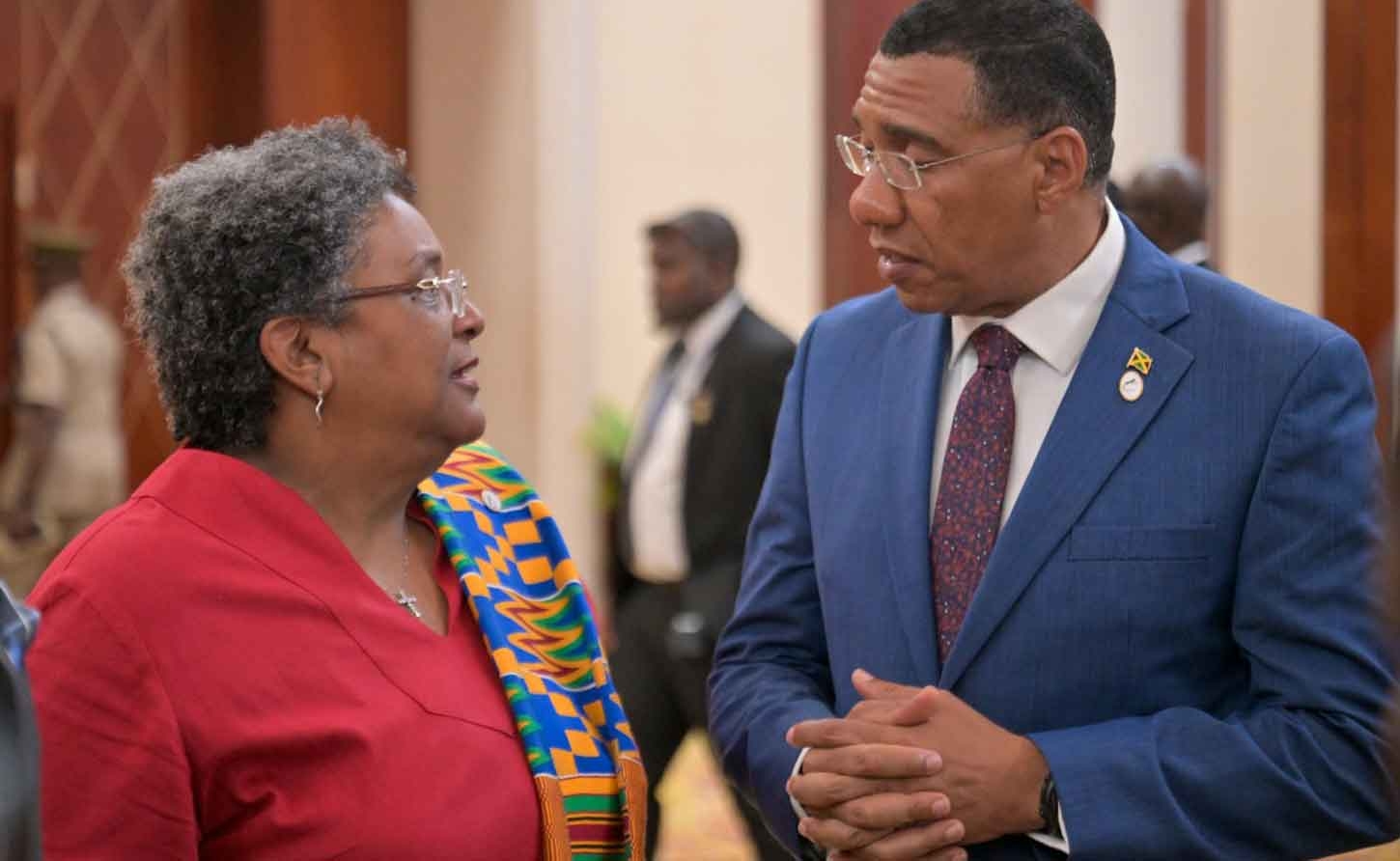 Barbados PM Mia Mottley converses with Jamaica's PM Andrew Holness at the CARICOM meeting in Montego Bay July 7, 2025