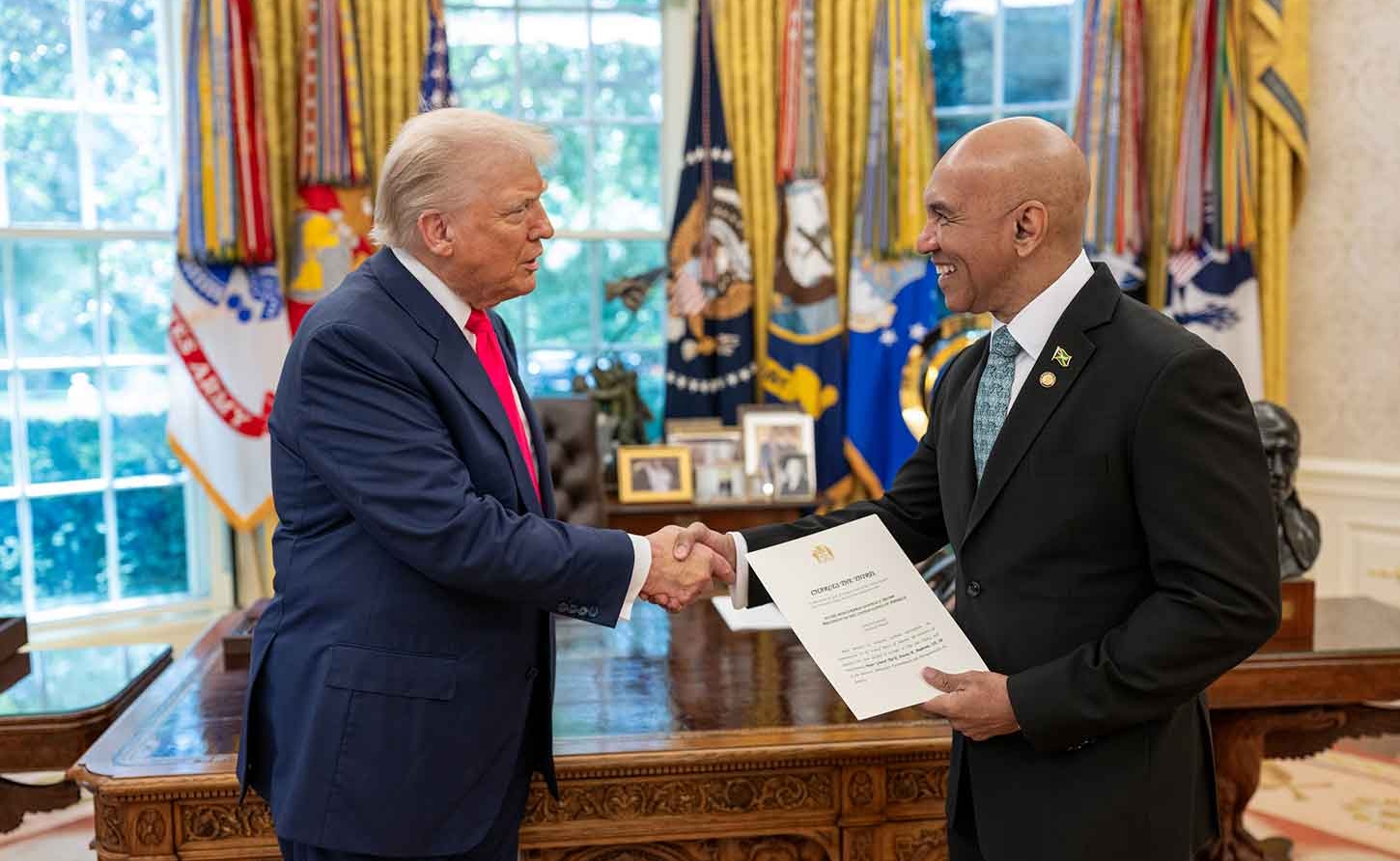 His Excellency Major General (Ret’d) Antony Anderson presents his Letters of Credence to President of the United States, Donald Trump during a brief ceremony held in the oval office at the White House on Thursday, July 24 2025.