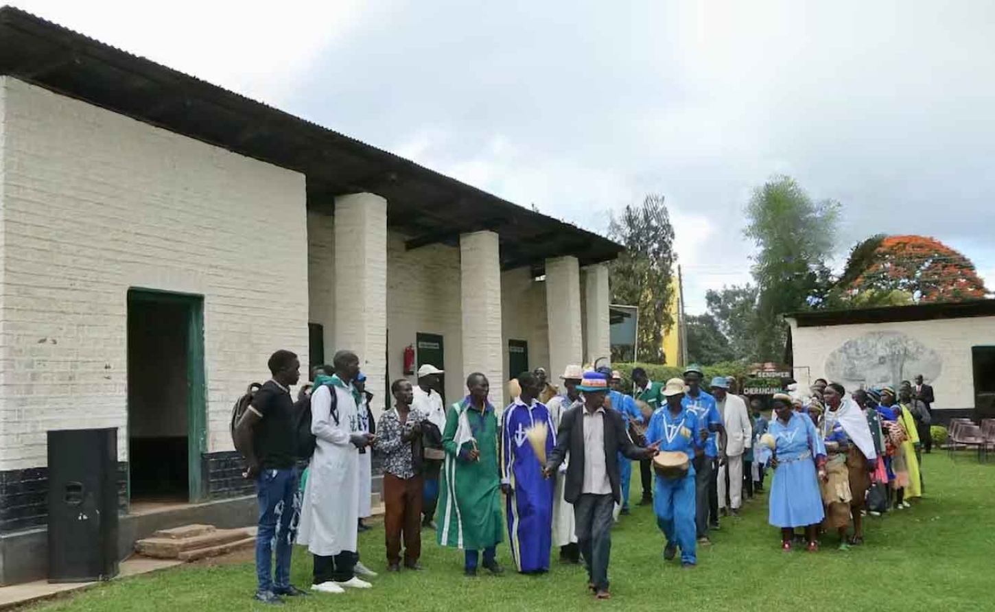 Dini ya Msambwa followers sing a religious song on the grounds of the Kapenguria Museum in northwestern Kenya, a former colonial prison where members of their movement were detained in the 1950s. Chloé Josse-Durand.