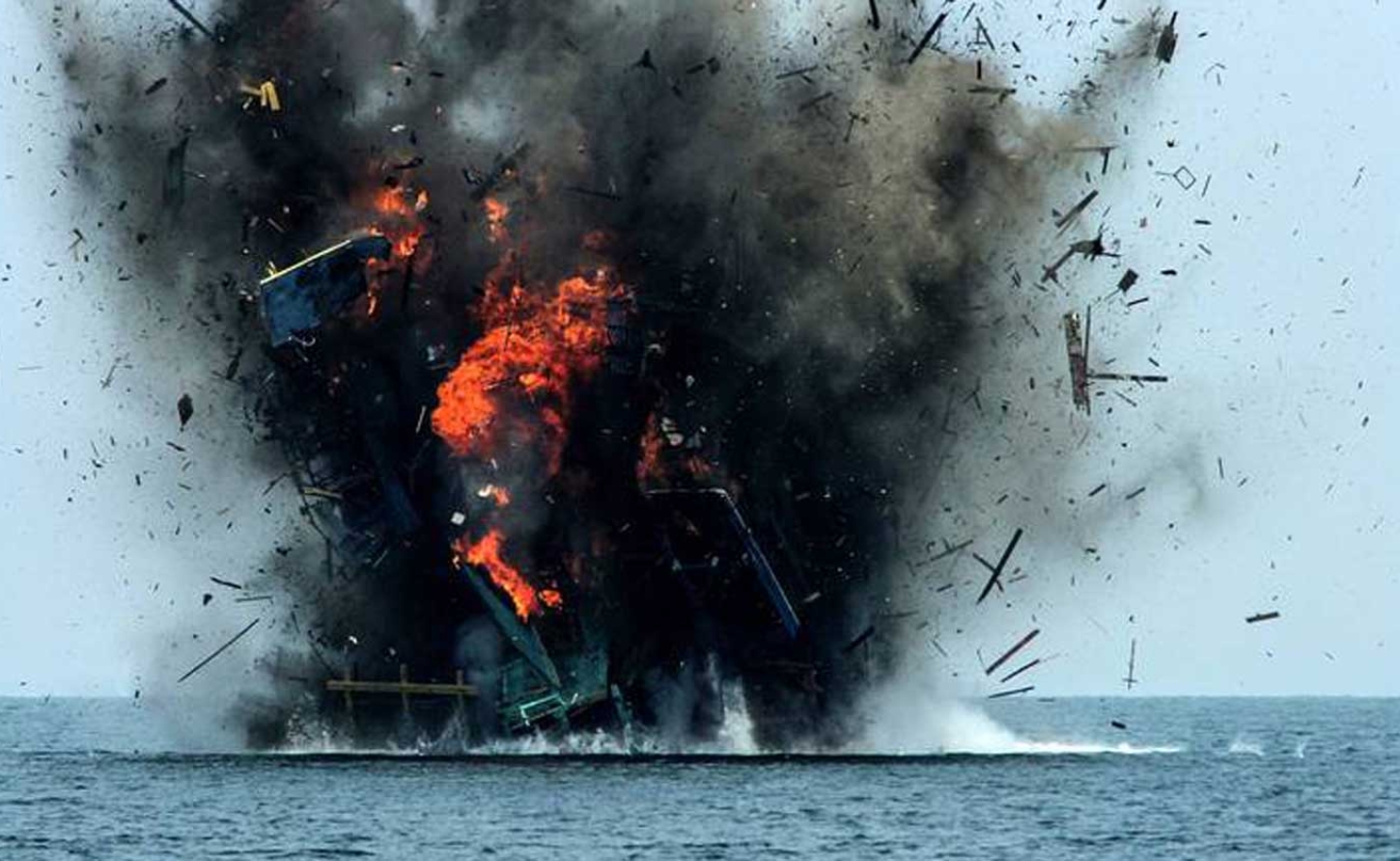Fishing boat being blown up in indonesia