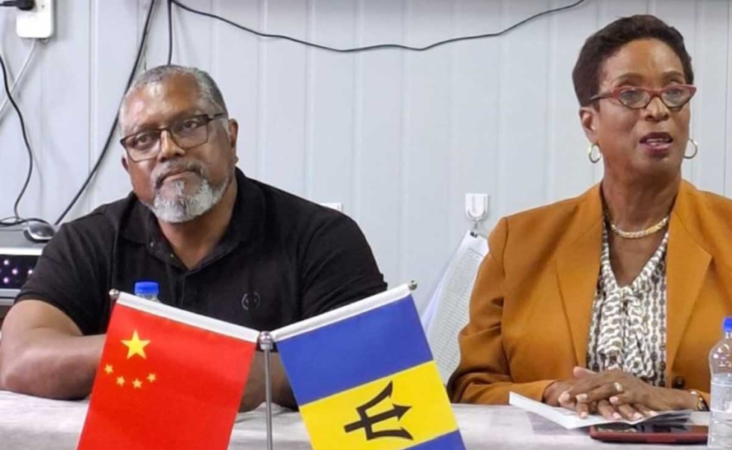 Minister of Training and Tertiary Education, Sandra Husbands, (right) speaking to the media during a recent tour of the Dukes Agricultural Station in St Thomas and the Hope Agricultural Institute in St. Lucy. Looking on is Minister of Agriculture, Food and Nutritional Security, Indar Weir. (N. Phillips/BGIS)