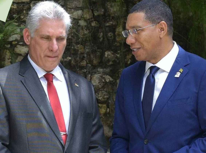 Cuban President  Miguel Díaz-Canel Bermúdez in conversation with Jamaica's Prime Minister Dr. Andrew Holnerss