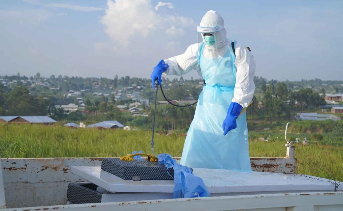 A health worker sprays the coffin containing the remains of Jacques Lobo Dhena who died of Ebola during a burial service in Bunia Ituri province, Eastern Congo August 12, 2026.| (AP Photo Dieudonne Dirole)