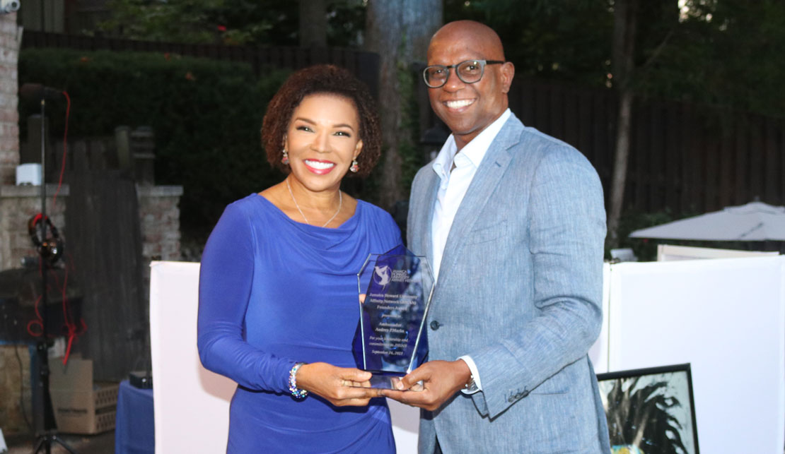 Jamaica's Ambassadoe Audrey Marks receives an awatd from Mr. Don Christian of the Jamaica Howard University Affinity Network (JHUAN) organization of which she is a co-founder.