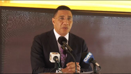 Prime Minister Andrew Holness addressing the handing over ceremony for a house under the National Social Housing Programme in Clifton, St. Catherine