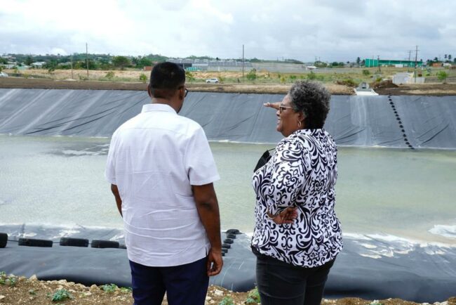 President, Dr. Mohamed Irfaan Ali and Prime Minister, Mia Mottley overlooking the reservoir.