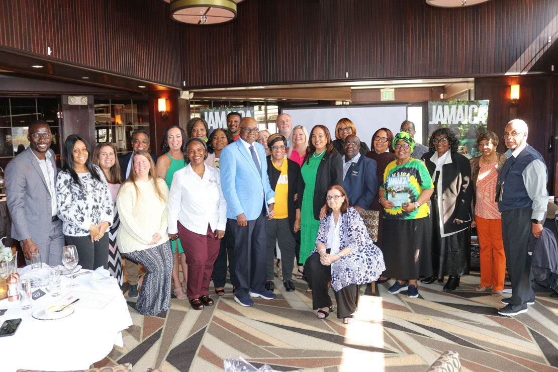 Minister of Tourism Hon. Edmond Bartlett center poses for a photograph with top travel agents from Baltimore and Philadelphia at a luncheon hosted by the Jamaica Tourist Board at McCormick & Schmick’s restaurant downtown Baltimore on Friday, April 12 (Photo Derrick Scott)