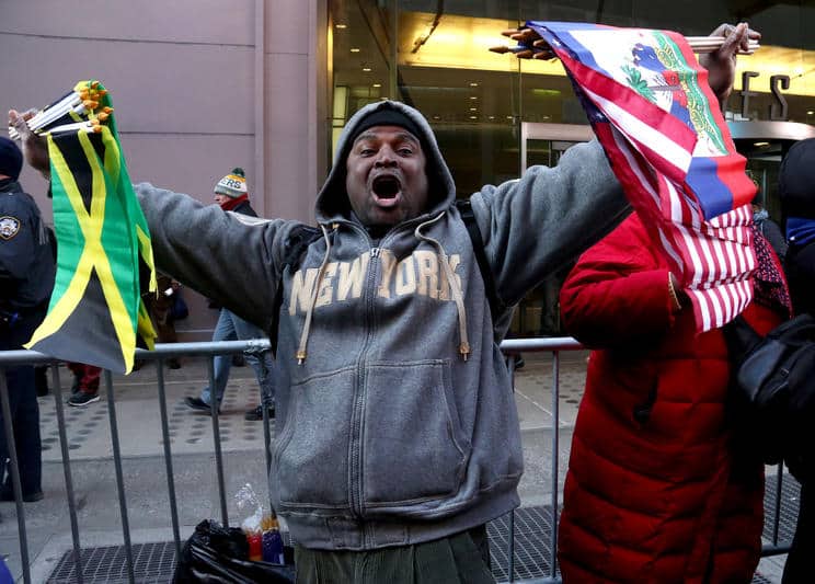 New York City, New York. 15 Jan 2018. A protester at the 'Rally Against Racism: Stand Up for Haiti and Africa' held on Martin Luther King's Birthday in Times Square. Credit: Nancy Kaszerman/ZUMA Wire/Alamy Live News