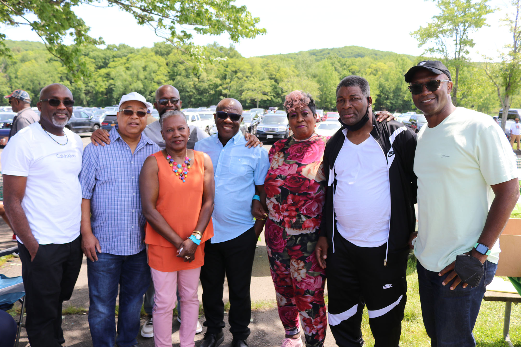 Falmouth’s Mayor Colin Gager (center) shares a light moment with fellow Trelawny parishioners.  From left Kenneth Bailey Charles Ramdatt   Alinthi Allwood Gallagher Violet Johnson Tomlin Anderson  Harry Peter Johnson and Loyal Ellis Occasion was the annual Trelawny Picnic at the Rockland County State Park in Nyack, New York, on Sunday, May 29. (DERRICK SCOTT photo)