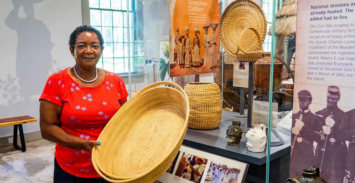 The ancient tradition of basketmaking continues as one of the oldest art forms of African origin in America. Today, Yvonne Groover teaches sweetgrass basketmaking classes throughout the region in an effort to preserve these traditions for future generations.