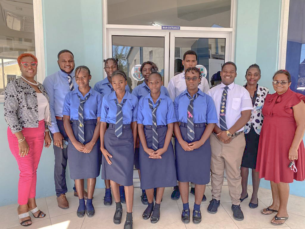 Scholarship recipients pose with Scholarship Committee Members Carol Newman (l), Consuelo Ricketts (r) and Guidance Counselors Mr. Ikula Pearce (2nd left) and Mrs. Paula Hall-Bedassie (2nd right).