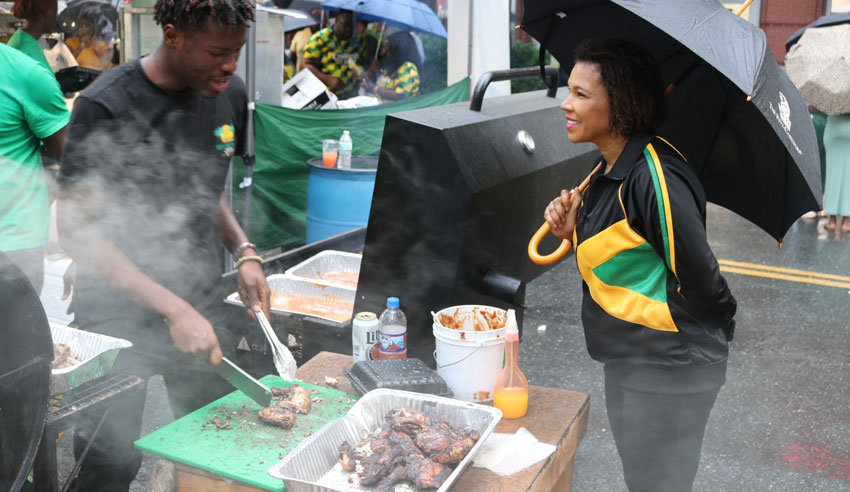 Jamaica’s Ambassador to the United States Her Excellency Audrey Marks place her order from a jerk chicken vender at Jamaica Fest Veterans Plaza i downtown Silver Spring, Maryland. Photo Derrick Scott