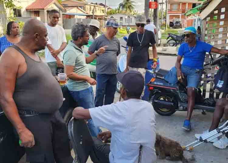 Former Georgetown City Mayor Pt. Ubraj Narine (in green polo shirt) interacting with East Ruimveldt residents. March 10, 2024