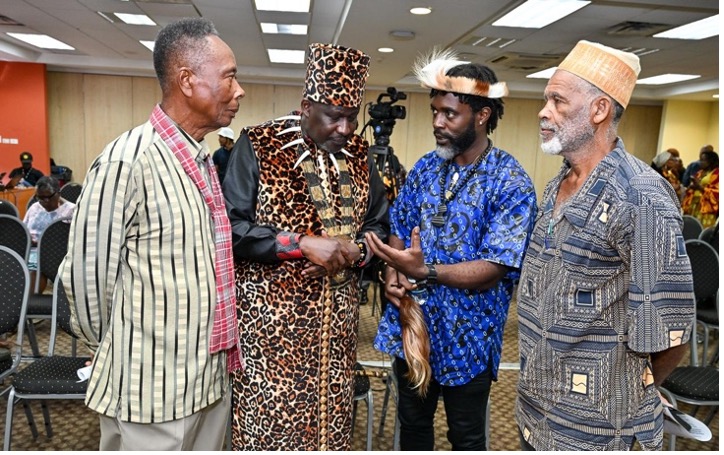 Jamaica's Maroon Chiefs capture the attention of His Highness Paul Eganda  at the Symposium.From Left are Lloyd Lattibeaudiere of the Scotts Hall Maroons;  His Highness Paul Eganda, President AIDO Network Intl. & Event Sponsor;Chief Richard Currie of the Accompong Maroons; Chief Wallace Sterling of the Moore Town Maroons | Photo by Global African Diaspora Kingdom