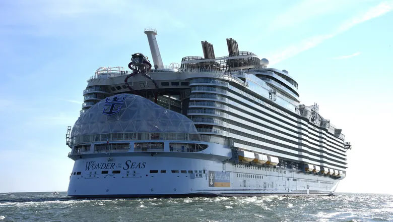 Royal Caribbean's Wonder of the Seas is currently the largest cruise ship in the world, taking the title from her sister ship Symphony of the Seas. At 1,188 feet long, 210 feet wide, and with a gross tonnage of 236,857, Wonder of the Seas is a massive vessel.  She has a capacity of 5,734 guests at double capacity and 6,988 guests total. With 2,300 crew onboard, the total capacity for Wonder of the Seas is 9,288 passengers!