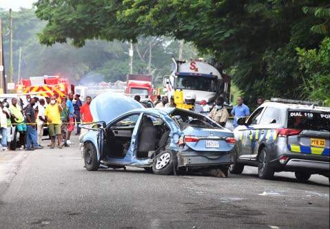 The motorvehicle crfash site showing the vehicle in which Kevin O Smitl and the young police constable Orlando Irons who was travelling in the same vehicle with Smith, died and two of his colleague policemen injured.