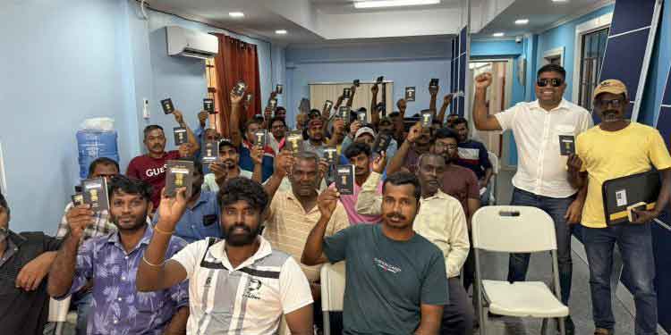 The Indian nationals retrieved their passport courtesy of Opposition Leader Azruddin Mohamed at right.