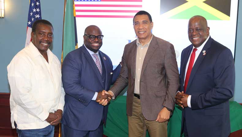 Prime Minister Andrew Holness receives a warm welcome from The President of Delaware State University Dr. Tony Allen as he arrives at the University on Thursday to attend a luncheon given in his honour by the University. Sharing in the occasion at left  is Member of Parliament for St, mary Western, Robert Montague and senior vice president for DSU Antonio Boyle | Derrick Scott Photo.