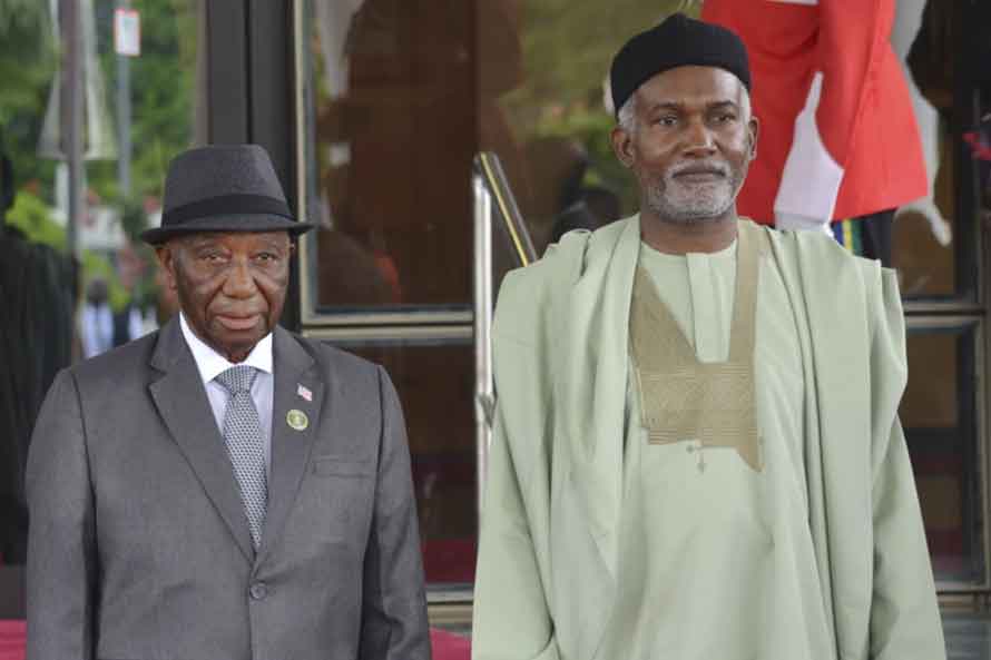 Liberia’s President, Joseph Boakai, left, and Nigeria Minister of Foreign Affairs, Yusuf Tuggar, right, pose for a photo, prior to the start of the ECOWAS meeting, in Abuja, Nigeria, July 7, 2024. (AP Photo/Olamikan Gbemiga, File)