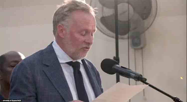 Charles Gladstone reading his family apology to the Guyanese people at the University of Guyana.