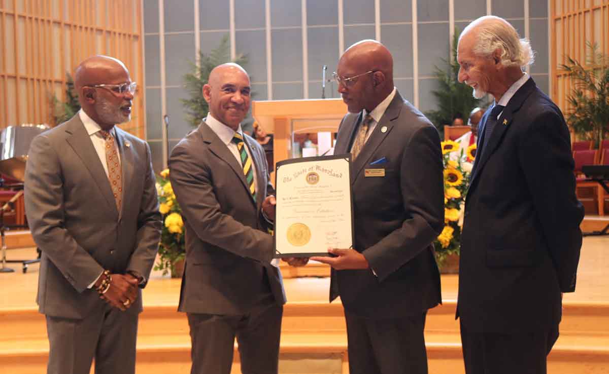 Ambassador Antony Anderson accepts a citation from Maryland’s Governor, Wes Moore presented by Reverend Lawrence Walker. Looking on from left are members of Maryland Governor’s Commission on Caribbean and Hispanic Affairs, Commissioner Louis McSween and Vice President, Ambassador Curtis Ward-(Photo Derrick Scott).