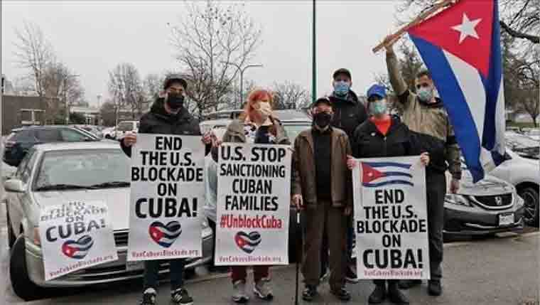 Citizens take part in a demonstration to reject the U.S. blockade against Cuba