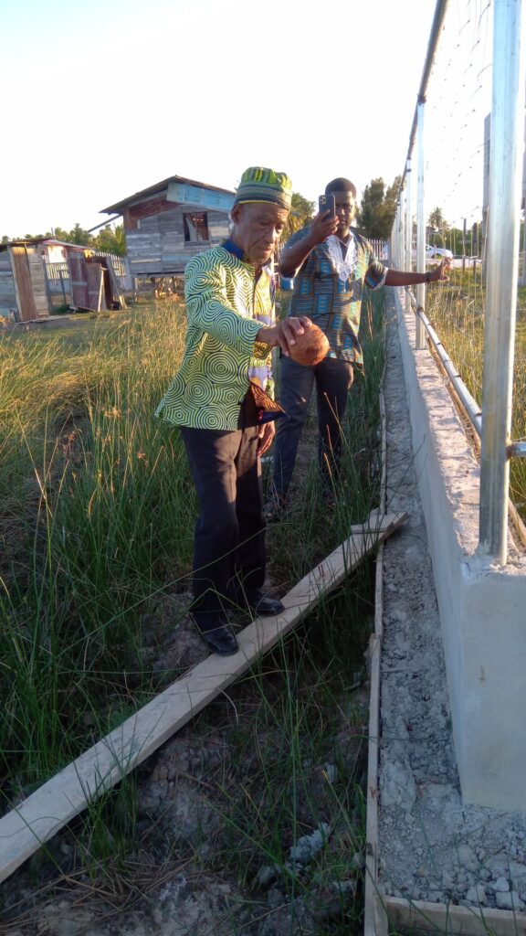 Libation ceremony performed by Dr. Rudy Guyan to honour memory and legacy of former slave and land owner Cudjoe McPherson , August 6, 2023