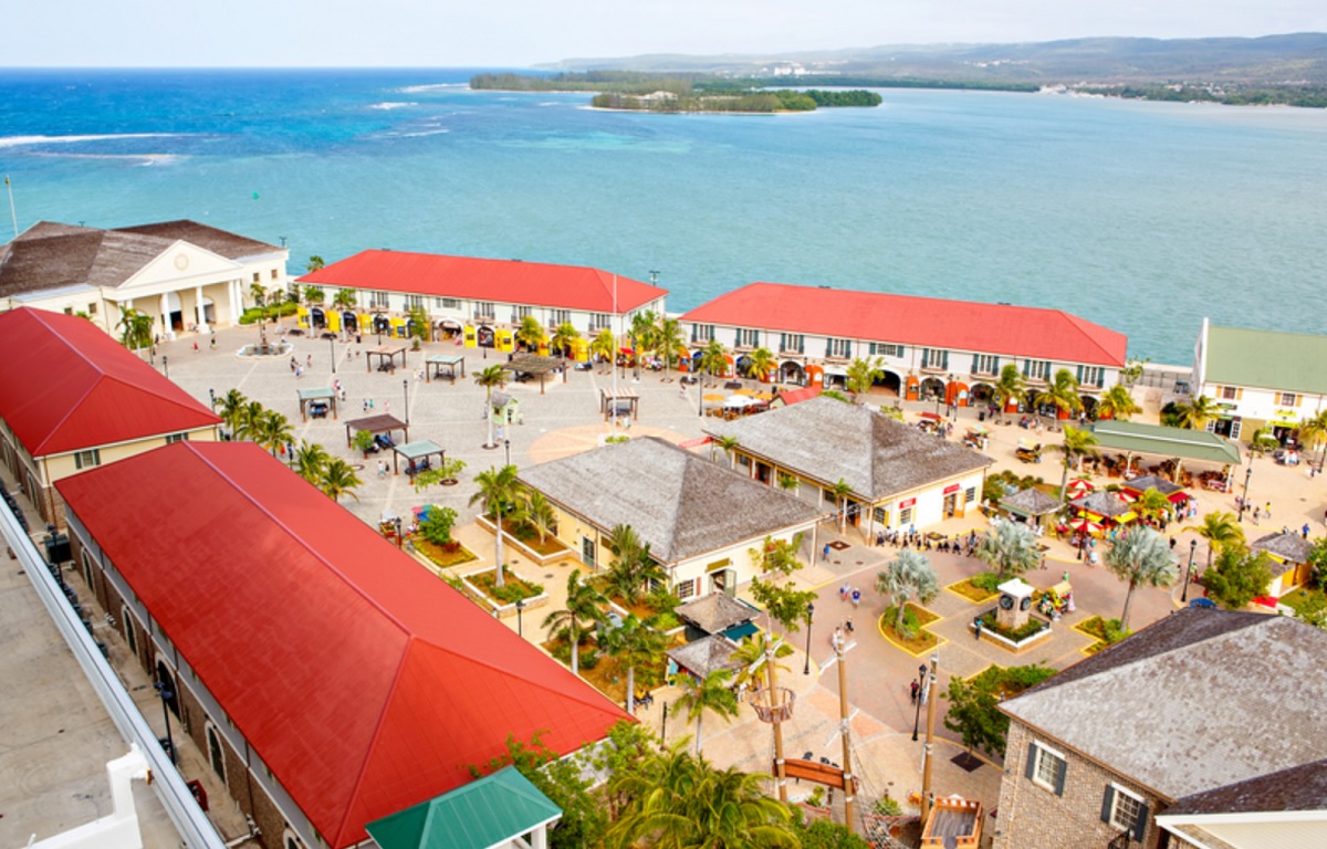 An overhead photographic view of Royal Caribbean's Falmouth Pier replete with its self-contained shopping area with shops of all description which offers the cruise passenger a taste of Jamaica without having to leave the comfort of the pier.