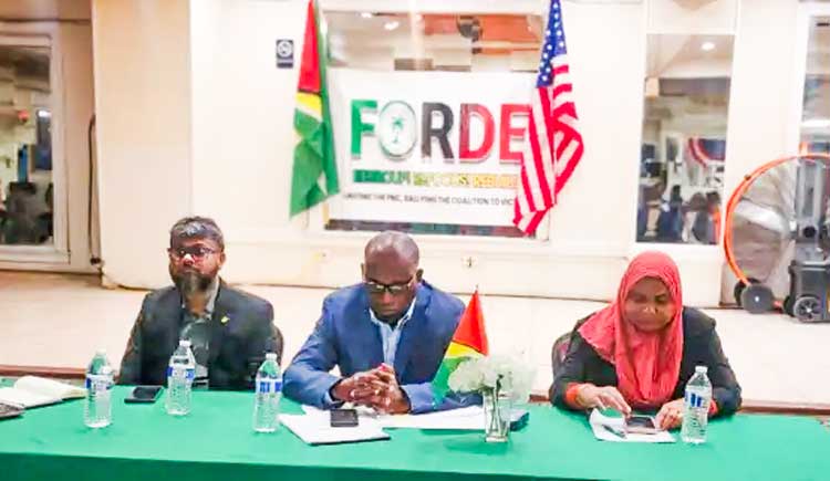 Roysdale Forde SC, MP with  former Mayor Pt. Ubraj Narine at left ,and Natasha Singh Lewis MP (right) at a Town hall meeting at Woodbine Ballroom, Brooklyn N.Y on May 10, 2024