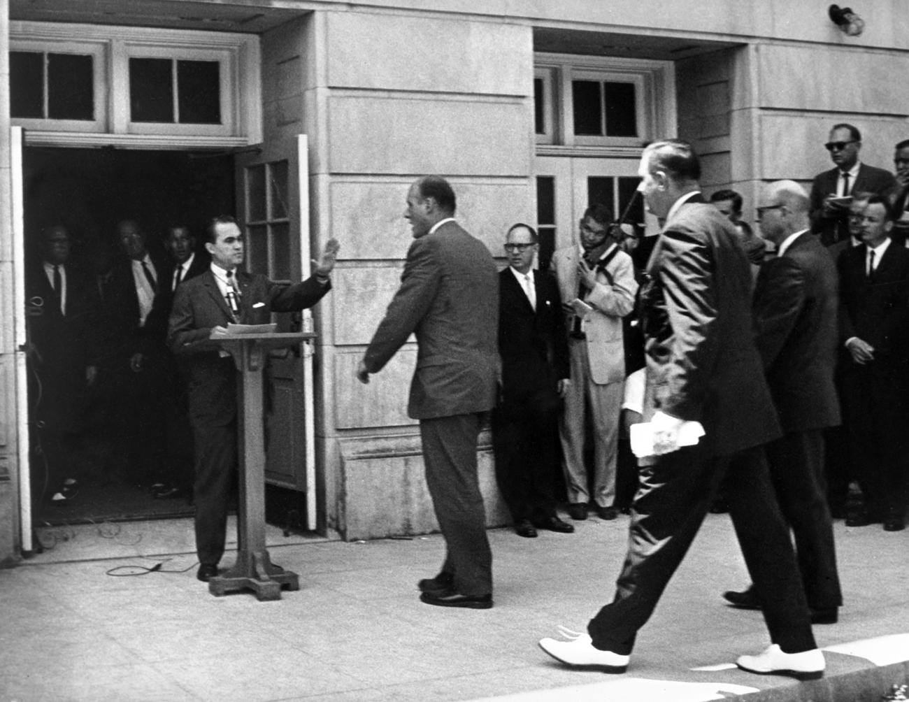 On June 11, 1963, then-Alabama governor George Wallace, who had vowed "segregation forever" at his inauguration, famously stood in the schoolhouse door at University of Alabama, blocking black students from entering.