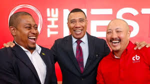 Agriculture minister Floyd Green share in a laughable moment with Prime Minister Holness and Caribbean Broilers executive Matthew Lyn