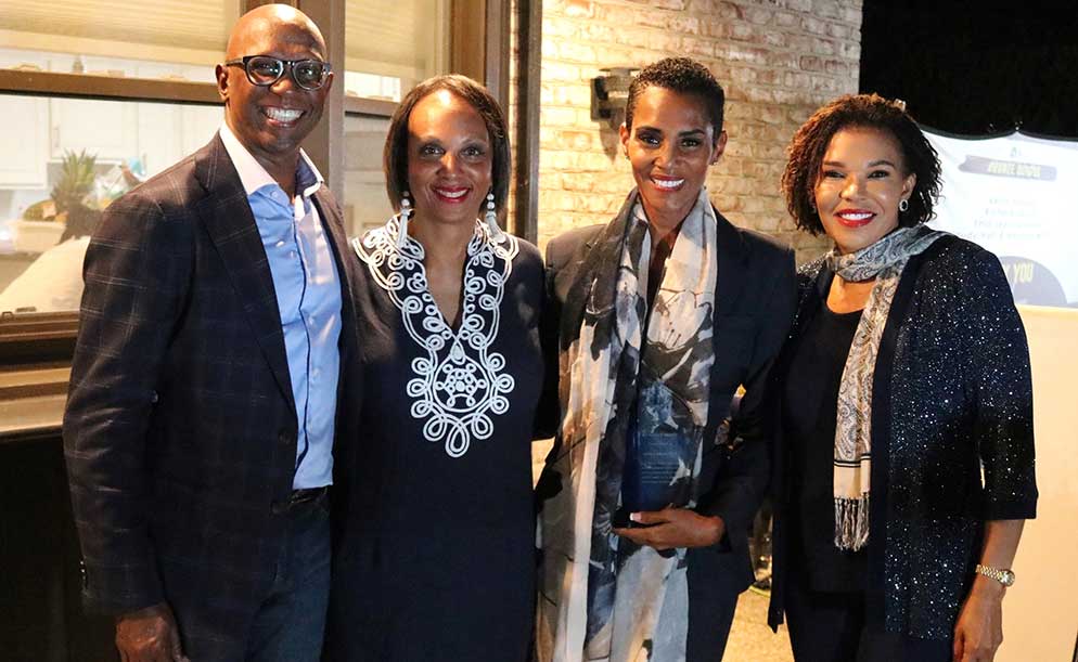 Jamaica’s Ambassador to the US Audrey Marks with  JHUAN IMPACT award winner architect Isiaa Madden recognized as an exemplary Howard Alumni for distinction in professional achievements.Sharing in the occasion are JUHAN Chairman  Don Christian (left) and executive member Dr Jacquelin Watson.| Derrick Scott Photo