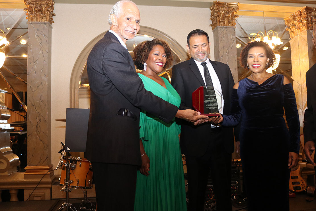  Jamaica’s Ambassador to the United States, Her Excellency Audrey Marks along with Ambassador Curtis Ward presents the Marcus Garvey Award to  Emmy award winning journalist from the CBS channel 9 station in Washington DC, Jamaican born Larry Sindass at the Jamaica Association of Maryland Independence Ball at Martin’s West, on Saturday 19thAugust 2023. Beside Mr. Sindass is his wife Dr. Lisa Boynes-Sindass.  (Derrick Scott Photo).