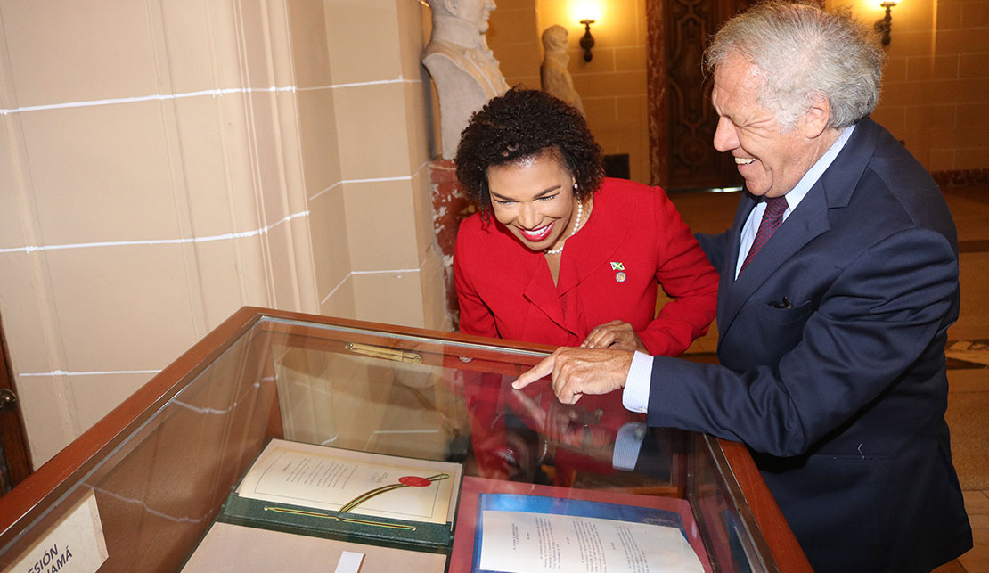 Jamaica's Permanent representative to the Organization of American States Ambassador Audrey Marks, and Secretary General of the OAS Luis Almagro views the Panama Treaty on September 7, at the OAS, in commemoration of the 46th anniversary of the signing of the Torrijos-Carter Panama Treaties on 7th September 1977. 