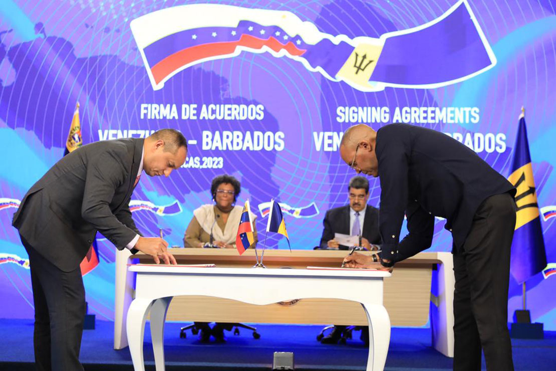 Foreign Minister Kerrie D. Symmonds signing the Air Services, Agriculture and Edication agteements with the Venezuelan Government over the weekend.