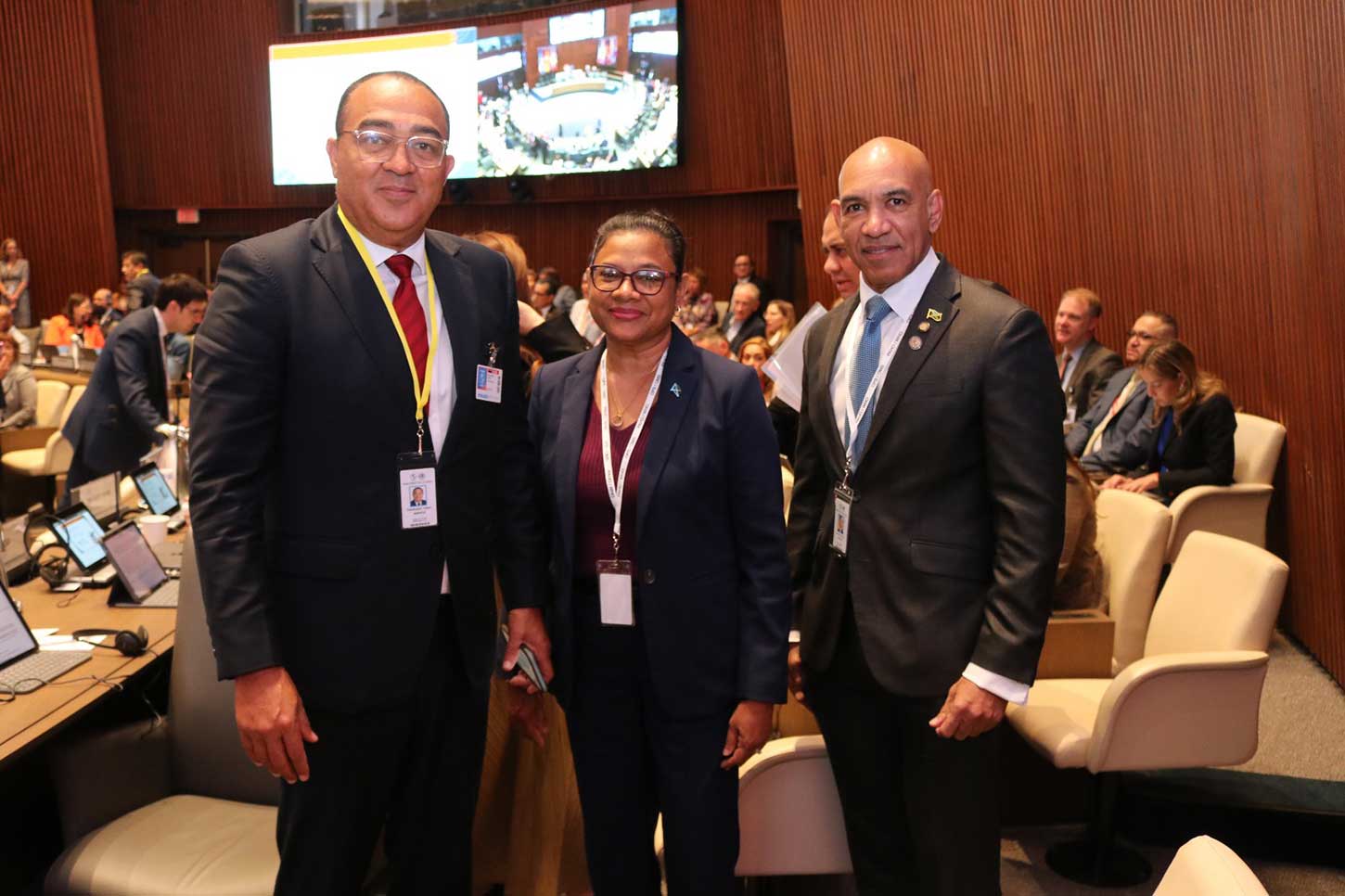 Minister of Health and Wellness, Dr.  Christopher Tufton, Chief Medical officer of Health Dr. Jacquiline Bisasor- Mckenzie and Jamaica’s Ambassador to the United States His Excellency Major General (Rtd) Antony Anderson share a light moment the 62nd Directing Council of the Pan American Health Organization (PAHO) at its headquarters in Washington DC Monday September 29.2025. Photo Derrick Scott.