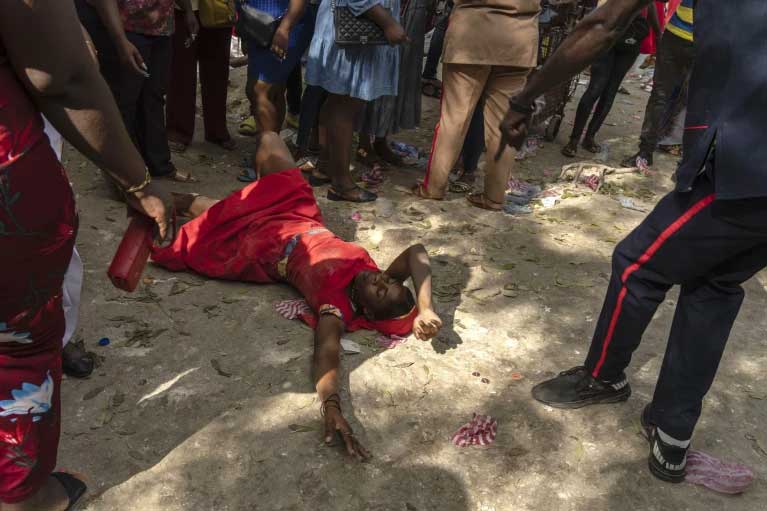 A Vodouist invokes a gede spirit during the Saint George celebration in Port-au-Prince, Haiti, April 24, 2024. (AP Photo/Ramon Espinosa, File)