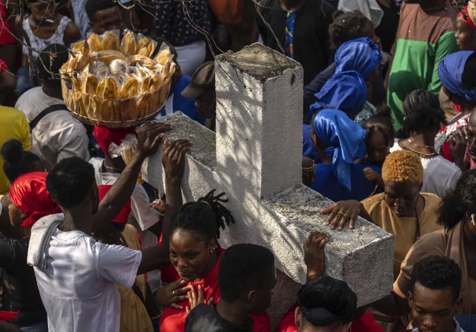 Vodou pilgrims gather round a cross during the Saint George celebration in Port-au-Prince, Haiti, April 24, 2024. (AP Photo/Ramon Espinosa, File)